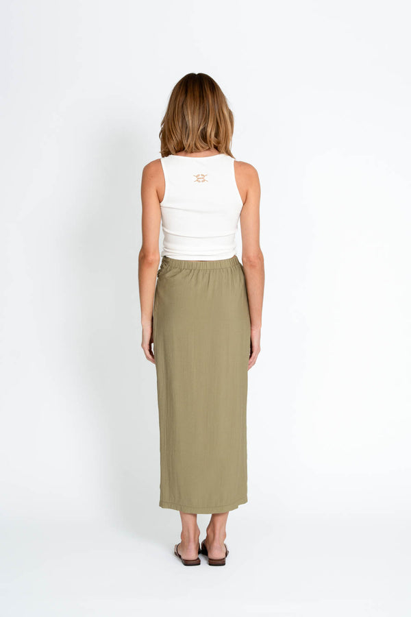 Ellotti white tank top and olive green skirt on a white background